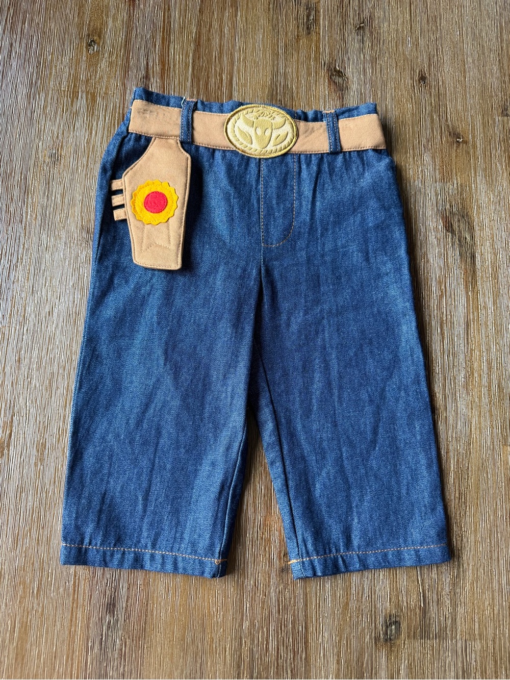 3/20$ Disney Blue Denim Kids Pants with Tan Belt and Red-Yellow Badge